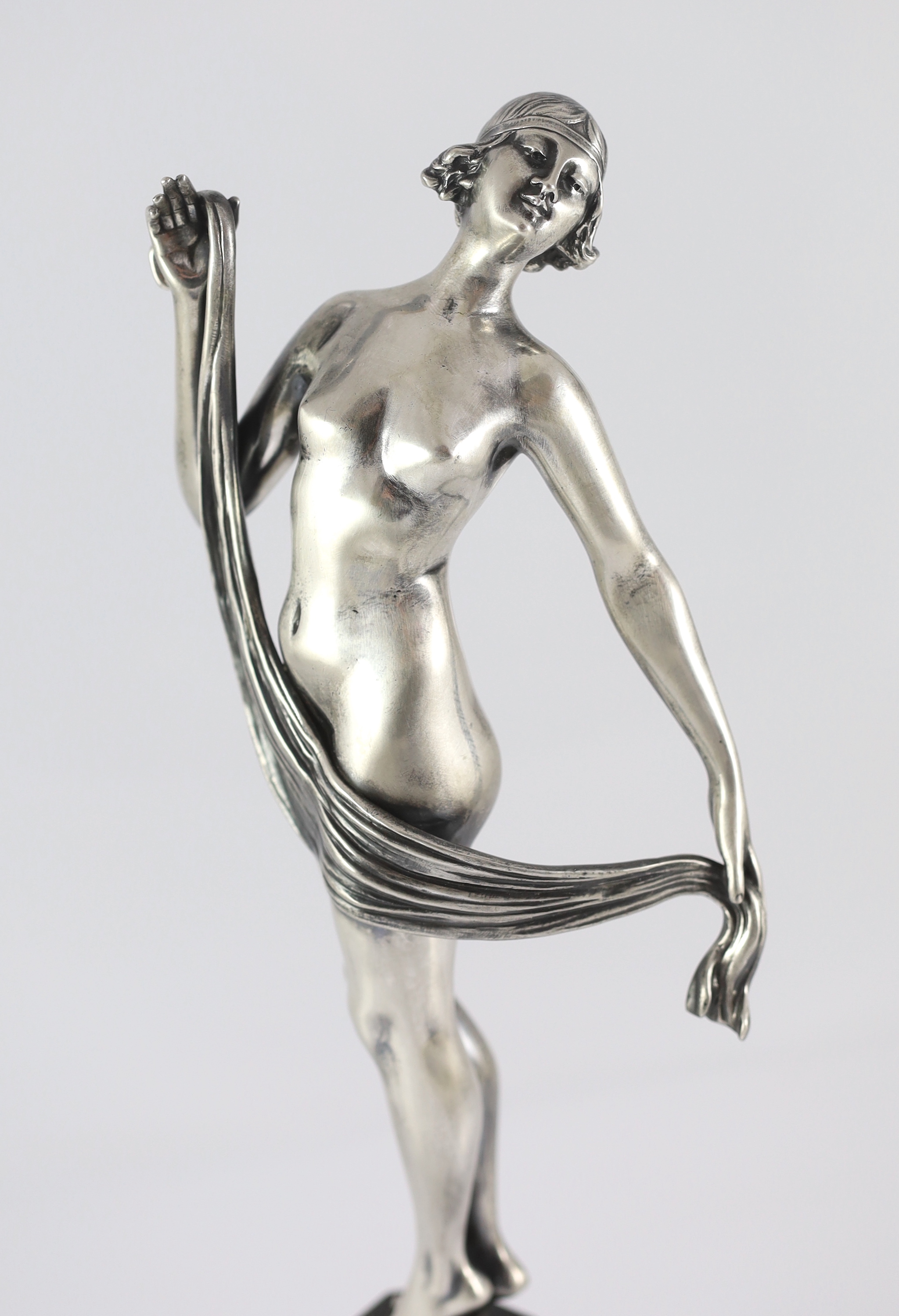 Henri Fugère (1872-1944). An Art Deco silvered bronze figure of a nude dancer 13cm wide, 39cm high